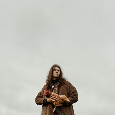 Close-up of hands in a meditative pose in a calm setting.